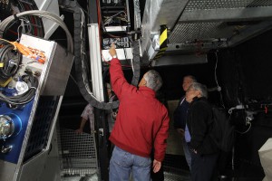 Telescope Manager Jeff points out the small telescope attached to PS1 that's used to monitor the transparency of the night sky. Credit: Douglas Finkbeiner